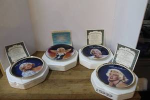 lot 147 image: vintage Bradford Exchange collector plates featuring Marilyn Monroe in their original styrofoam packaging with authenticity papers