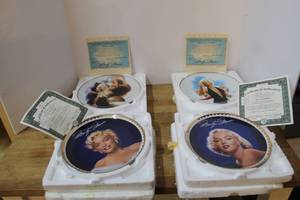lot 148 image: vintage Bradford Exchange collector plates featuring Marilyn Monroe in their original styrofoam packaging with authenticity papers
