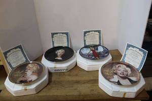 lot 152 image: vintage Bradford Exchange collector plates featuring Marilyn Monroe in their original styrofoam packaging with authenticity papers