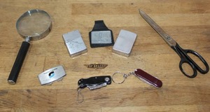 lot 199 image: Lighters and a few small keychain knives and much more see pictures for details