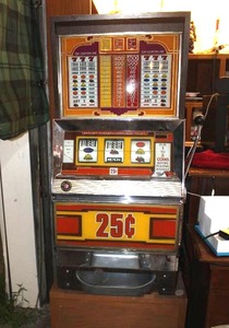 vintage Bally 25-cent mechanical slot machine comes with stand it is setting on as well also co.es with the key