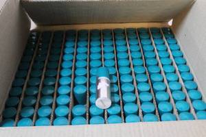 lot 205 image: Box full of travel size Sweet Bouquet moisturizing lotion. Over 100 in box
