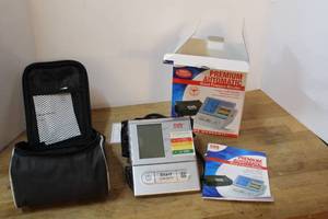 lot 207 image: CVS Pharmacy Premium Automatic Blood Pressure Monitor, featuring irregular heartbeat detection and storage for two users
