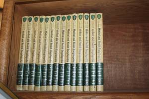 lot 250 image: volumes from The New Illustrated Medical and Health Encyclopedia, a 14-volume set published in the 1950s or 1960s