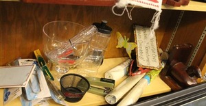 lot 264 image: Shelf full of things that didnt make it in lots