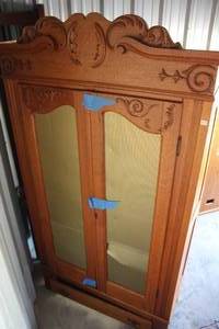 lot 284 image: French-style armoire is crafted from solid oak and features ornate carvings going to need a few repairs hinge on left door bottom came disconnected see pictures for details