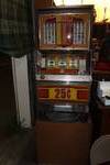 vintage Bally 25-cent mechanical slot machine comes with stand it is setting on as well
