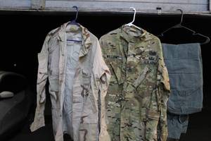 lot 111 image: US Army uniform tops and more