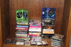 lot 112 image: Mix of CDsDVDsand tapes and a few games( the Nintendo switch are just cases no games in them )
