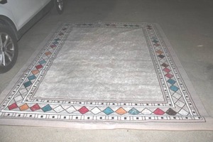 lot 134 image: Rug about 121 inches long by 94 inches wide