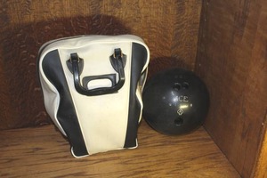 lot 171 image: vintage black hard-rubber bowling ball and bag