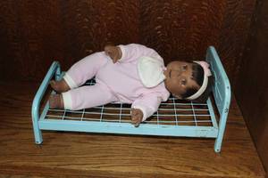 lot 205 image: vintage blue metal doll bed and realistic collectible baby doll