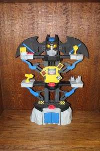 lot 223 image: the Fisher-Price Imaginext DC Super Friends Transforming Batcave lights up