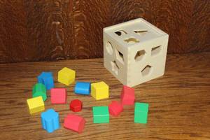 lot 243 image: classic wooden shape-sorting toy