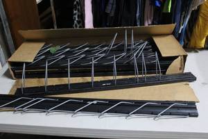 lot 280 image: wall-mounted V-belt display racks