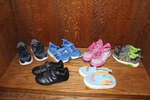 lot 318 image: Lot of kids shoes the teenage mutant Ninja turtles in right corner light up and Skechers  in left corner light up