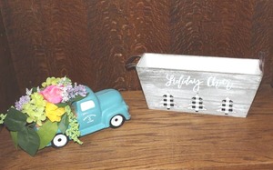 lot 321 image: vintage Chevy truck ceramic planter features a vibrant arrangement and whitewashed wooden decorative basket