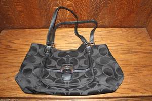 lot 366 image: Coach Campbell Signature Belle black jacquard and leather shoulder bag featuring dual top handles and a front buckle flap pocket.