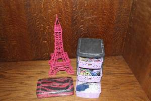 lot 435 image: Metal Eiffel Tower small 3-drawer full of hair bands and more see pictures