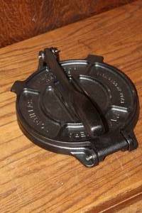 lot 448 image: Victoria Cast Iron Tortilla Press featuring a heavy-duty textured black finish and an integrated lever arm