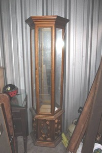 lot 455 image: hexagonal wooden curio display cabinet features glass paneling and ornate carved wood detailing on the lower base with glass shelfs