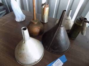 lot 69 image: Oil cans and metal funnels