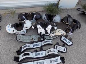 lot 213 image: Football shoulder pads 5 Douglass back plate x4