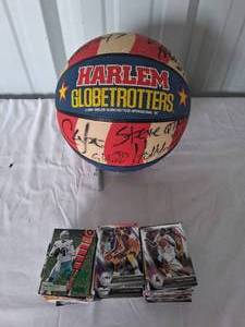 lot 29 image: Autographed Harlem Globetrotter Basketball with a Selection of Basketball and Football Cards---Authentication Unknown