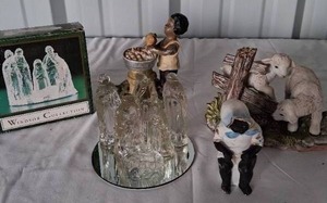 lot 53 image: 7 Piece Glass Nativity Set, Enesco Lambs, Patsy Figurine and Antique Bisque Potty Baby