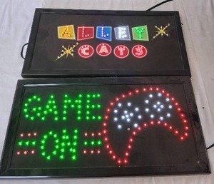 lot 110 image: Alley Cats and Game On Light Up Signs---Work