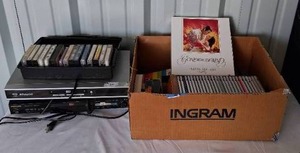 lot 140 image: Mixed Media Lot with VHS Tapes, DVD Players and Music Tapes and CDs