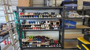 lot 183 image: Black 4-Tier Garage Shelving.  Each Shelf Holds Up To 2,000 lbs.   THIS SHELF MUST BE PICKED UP AFTER 4PM ON SATURDAY AUGUST 1STCONTENTS NOT INCLUDED (BUT IF YOU WANT SOME NEW ADIDIAS I WILL SELL YOU SOME)