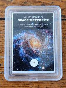 lot 46 image: Authentic space meteorite in plastic case