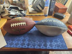 lot 91 image: Pair of footballs - Dallas Cowboys and NFL