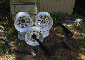 lot 62 image: set of 5 Vintage white spoke modular steel wheels, hitch receiver, draw-tite trailer hitch,2 old metal front bumpers, and passenger door assembly from 1967-1972 chevrolet or gmc ck series pickup truck