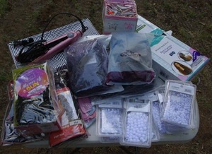 lot 69 image: Hair wigs and pieces, and also a straightner