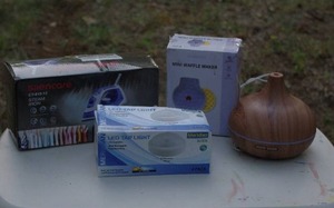 lot 71 image: New iron in box, mini waffle maker in box, led tap lights in box, diffuser