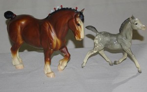 lot 114 image: Vintage Breyer Clydesdale and glossy grey appaloosa running foal (see photos for flaw on clydesdale mane)