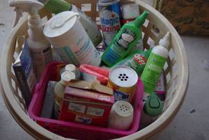 lot 169 image: Basket of cleaning supplies and dog medicine
