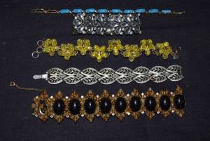 lot 195 image: Vintage style bracelets (silver-toned bracelet is by Coro)