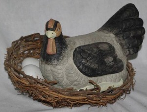 lot 210 image: Ceramic hen with 4 ceramic eggs and nest