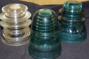 lot 228 image: 3 Vintage glass pole insulators- Hemingray Glass Company