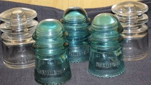 lot 229 image: 5 Vintage glass pole insulators- Hemingray Glass Company