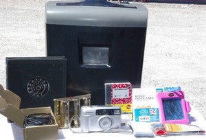 lot 232 image: Paper shredder, address book, coin dispenser, samsung 35mm camera, and other misc office items