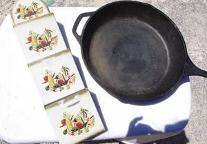 lot 243 image: Vintage metal 3 pocket wall-mounted mail and letter organizer and Large cast iron skillet