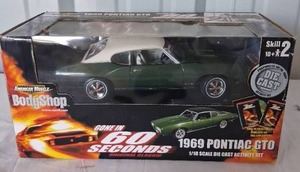 lot 119 image: 118 Scale Gone in 60 Seconds 1969 Pontiac GTO American Muscle Bodyshop---This has been assembled and on display