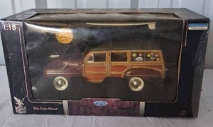 lot 120 image: Signature Series 118 Scale 1948 Ford Woody Station Wagon with Collector Coin and Surfboard--Box has some damage