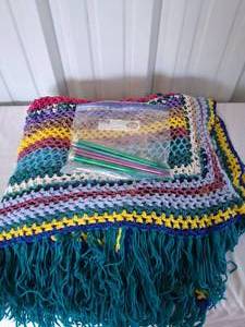 lot 149 image: Hand Made Crocheted Afghan Blanket and Knitting Needles