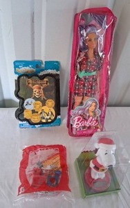lot 150 image: Selection of Toys--Pirates of the Caribbean Mystery Figure, Snoppy Bobblehead, Goofy Mcdonalds Toy, and Barbie Doll