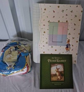 lot 151 image: Beatrix Potter Tale of Peter Rabbit Baby Keepsake Box, Book, and Bag of Baby Bibs